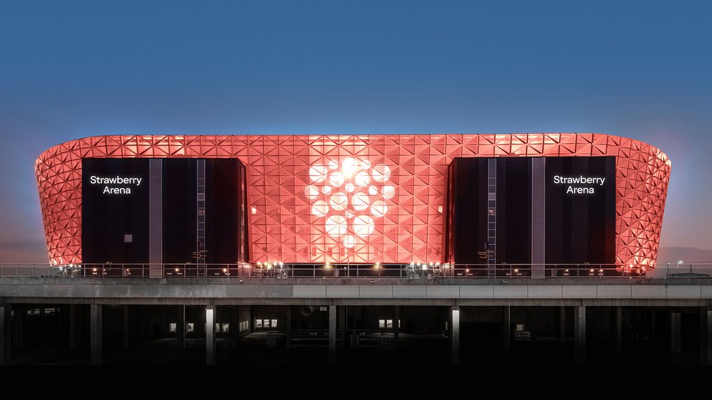 The sunlit exterior of Strawberry Arena on a clear day.